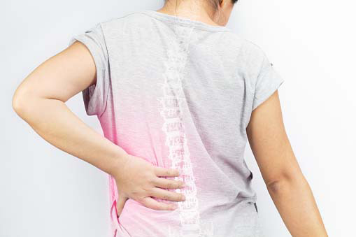 young woman experiencing back pain